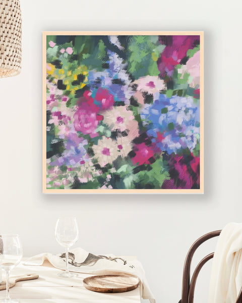 pretty abstract floral flowers in pink and purple and greenery in the background